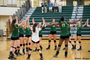 The volleyball team celebrates after a big win against Northview.
